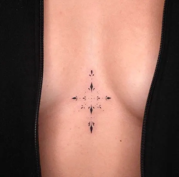 Geometric sternum tattoo.