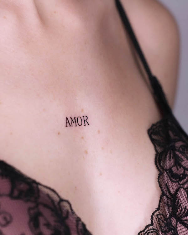 One-word chest tattoo for women by @giuliinklab