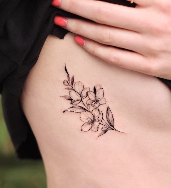 Simple black and grey flower tattoo by @hadam.collection