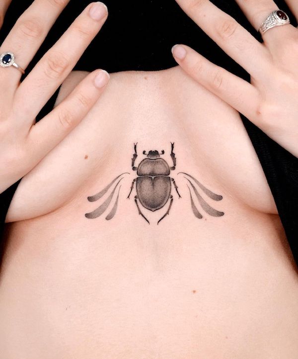 Small beetle underboob tattoo by @choiyun_tattoo