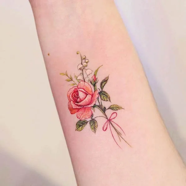 Small flower bouquet forearm tattoo by @vane.tattoo