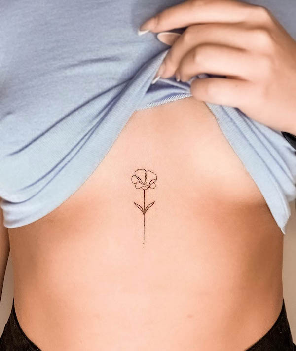 Small flower underboob tattoo by @oanhabram