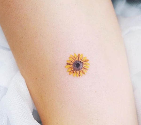 Small sunflower tattoo by @element_inker