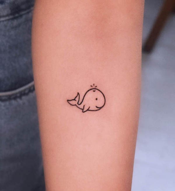 Small whale tattoo by @homeboytattooer
