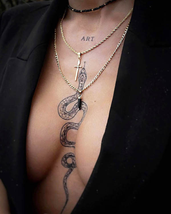 Snake between the boobs tattoo by @chalilofee