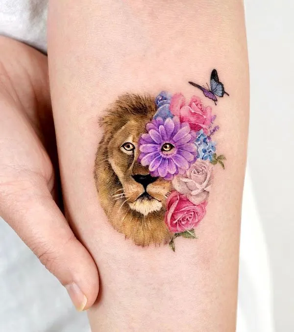 Stunning floral lion forearm tattoo for women by @songe.tattoo