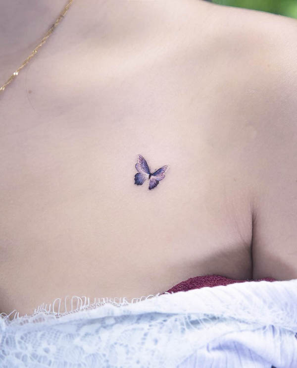 Tiny butterfly chest tattoo for women by @arona_tattoo