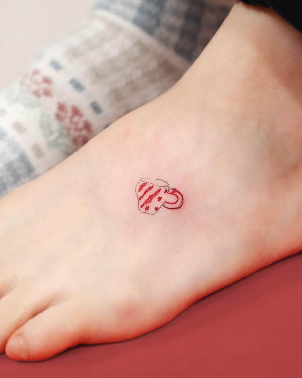 Cute small mug foot tattoo by @yeguclub