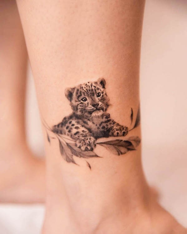 Cute cheetah ankle tattoo by @polar.tattooing
