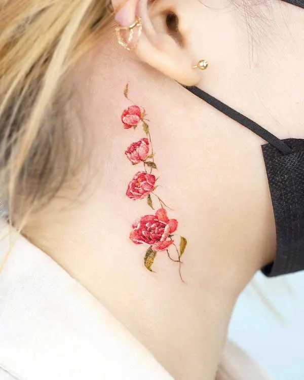 Flowers behind the ear tattoo by @tilda_tattoo