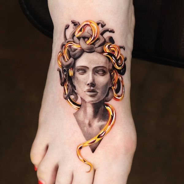 Golden Medusa foot tattoo by @jooa_tattoo