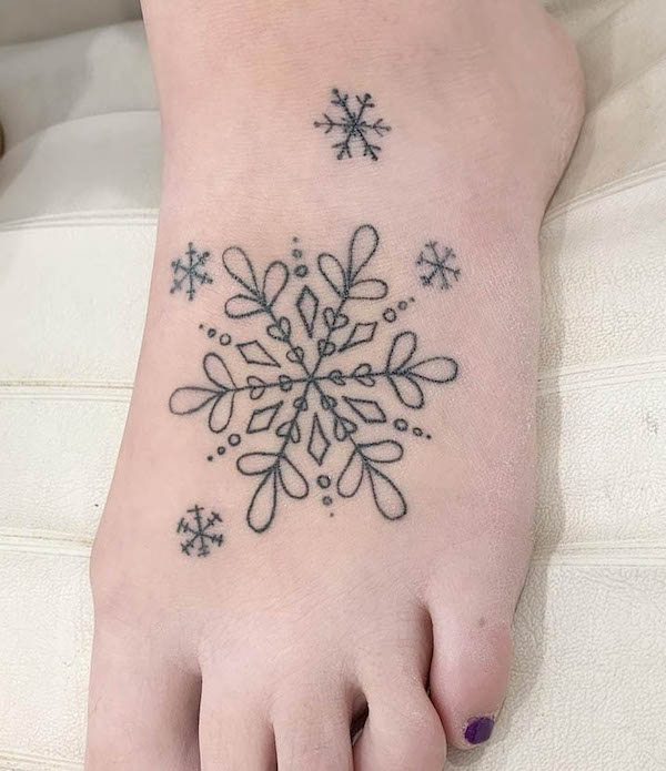 Intricate snowflake foot tattoo by @robynmarshalltattoo