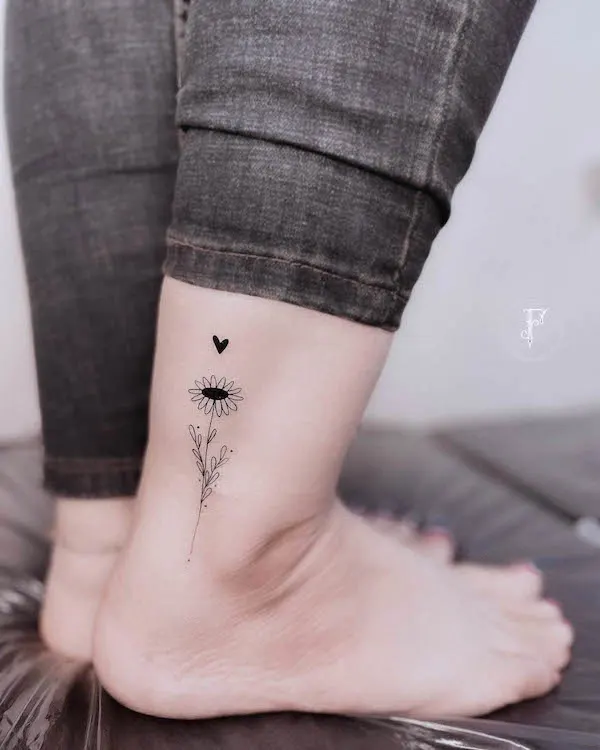 Simple flower ankle tattoo by @tattooebrahimi
