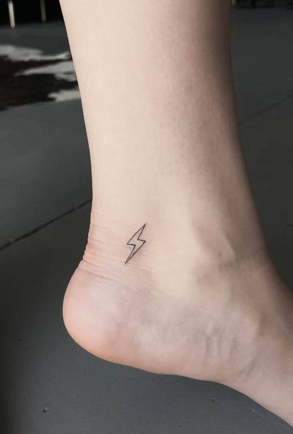 Small lightning foot tattoo by @finelinesby.aj