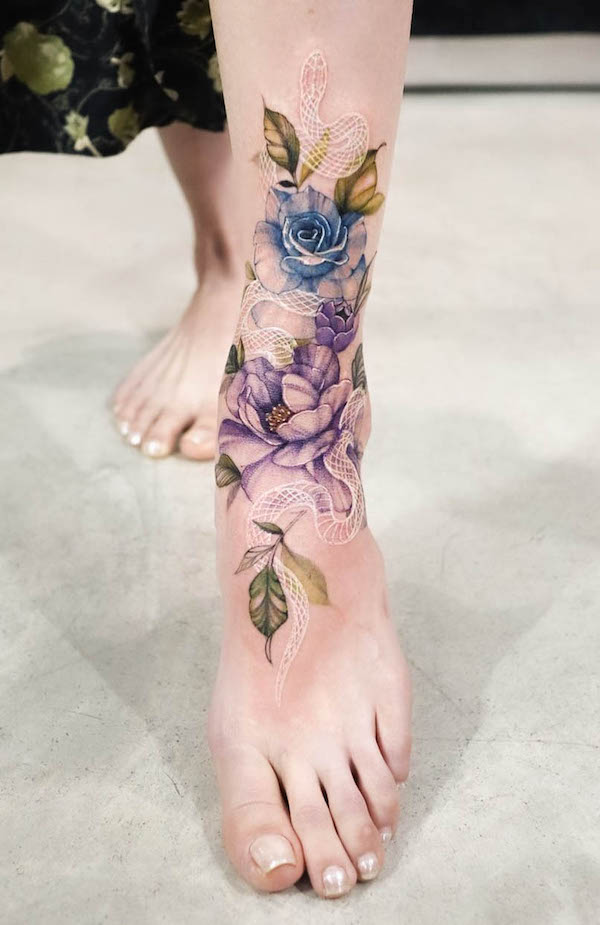 White snake and flowers foot tattoo by @tattooist_silo
