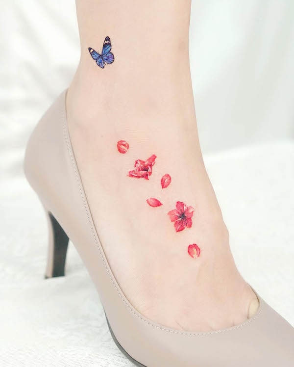 Petals and butterfly @tilda_tattoo