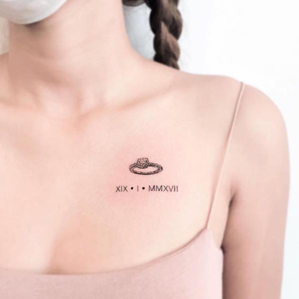 Cute wedding ring tattoo on the chest by @mood_bkk