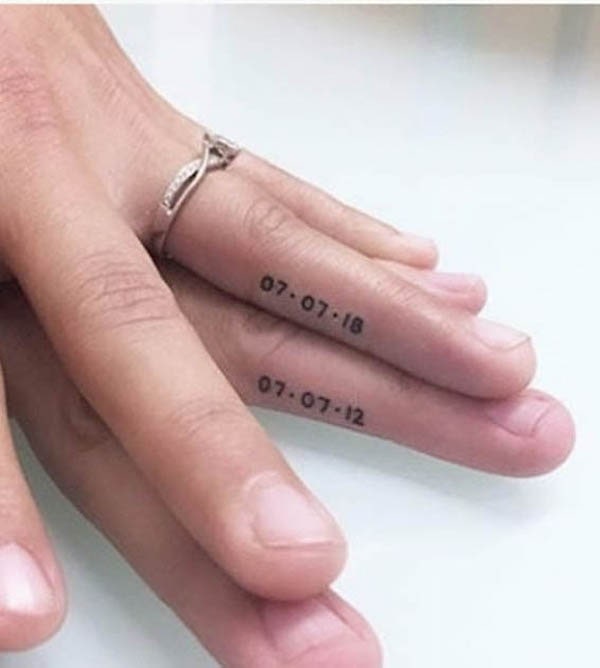 Date tattoos on the ring finger by @shaadibag
