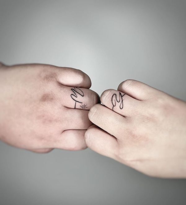 Initial script wedding ring tattoos by @deep0809.tattooer