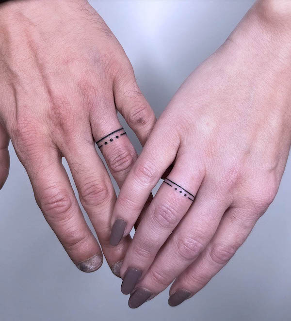 Lines and dots wedding ring tattoos by @tattoo_prik