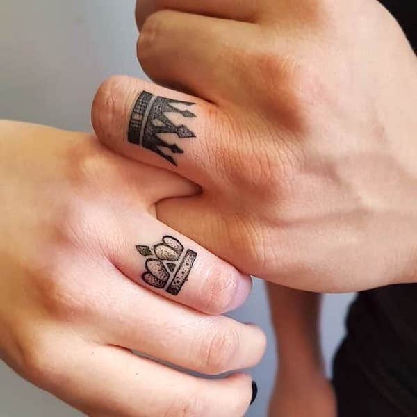 Matching king and queen ring finger tattoos by @john_martin_tattoo