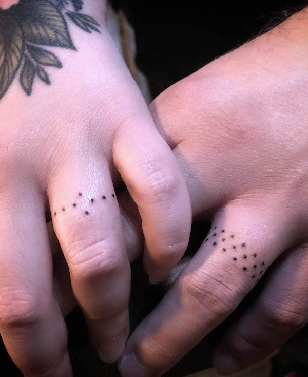 Simple dots wedding ring tattoos by @ihudatattoo