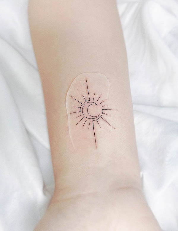 Simple sun and moon fine line tattoo by @mariash.ink