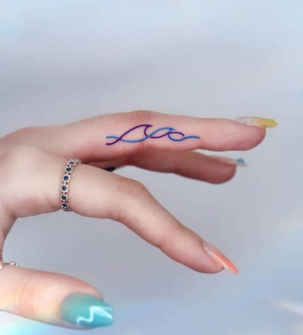 Wave tattoo on finger meaning