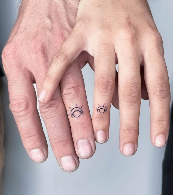 Sun and moon wedding ring tattoos by @blair_ding