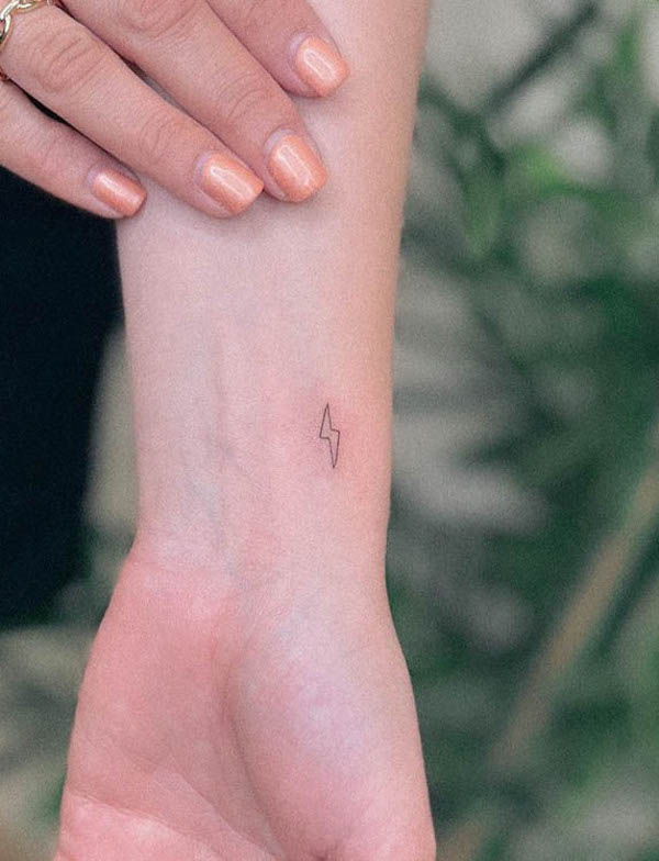 Tiny lightning wrist tattoo by @taniabodyart