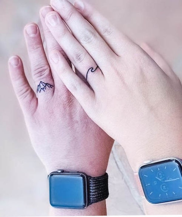 Wave and mountain matching ring finger tattoos by @jdot5512 1