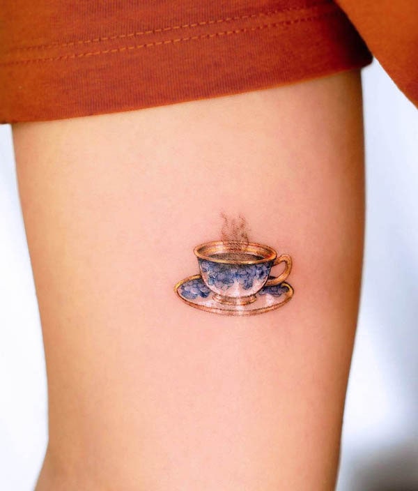 Beautiful porcelain coffee cup tattoo by @marcelabadolatto