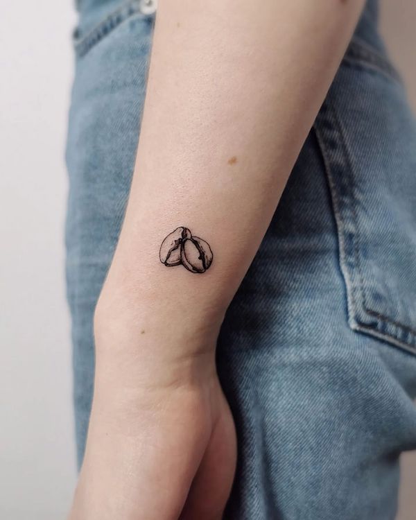 Small coffee beans tattoo by @madlen.tattoo