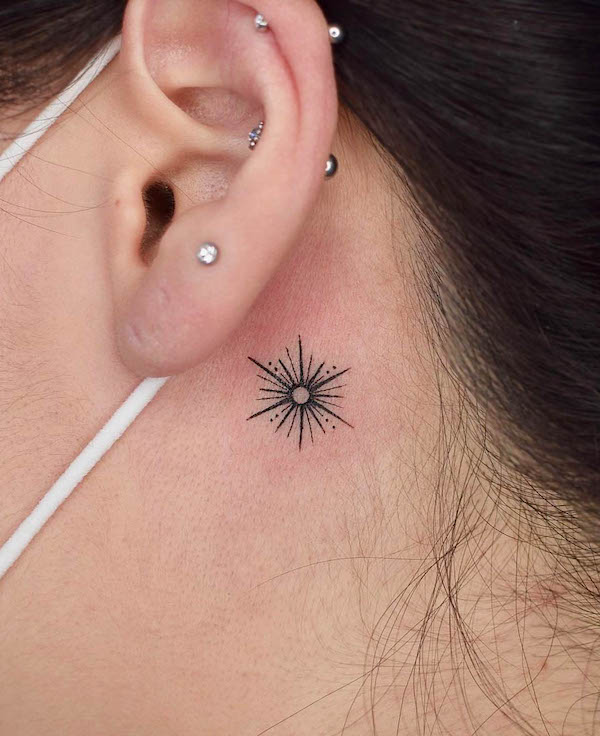 Small shining star behind the ear by @tattooer_jina