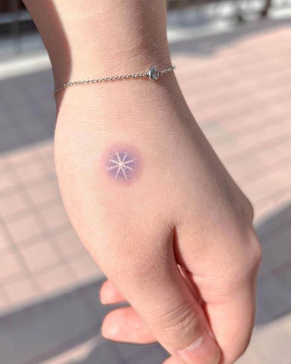 Small shining star hand tattoo by @gigitat