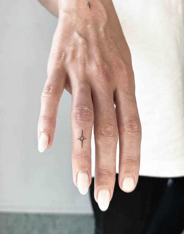 Small star finger tattoo by @ninefinelines