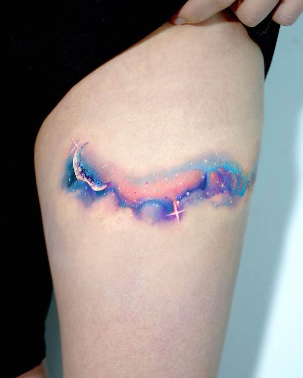 Watercolor aurora thigh tattoo by @mooongnyum_tattoo