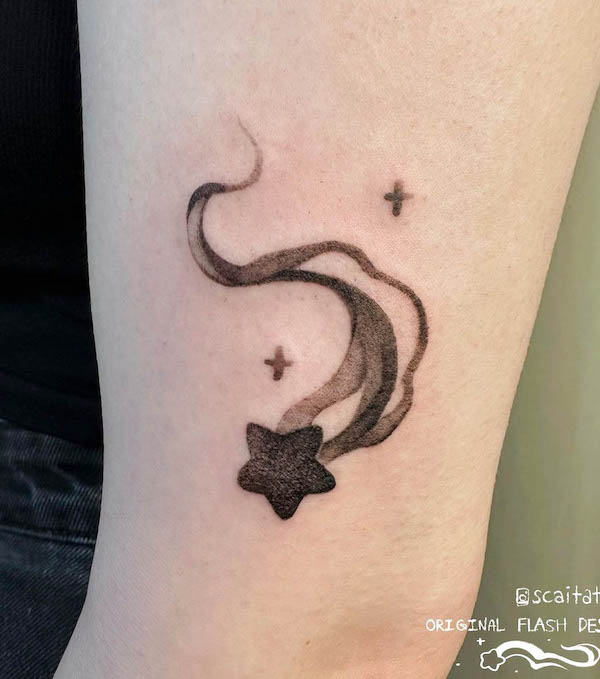 Whimsical black star tattoo by @scaitattoo
