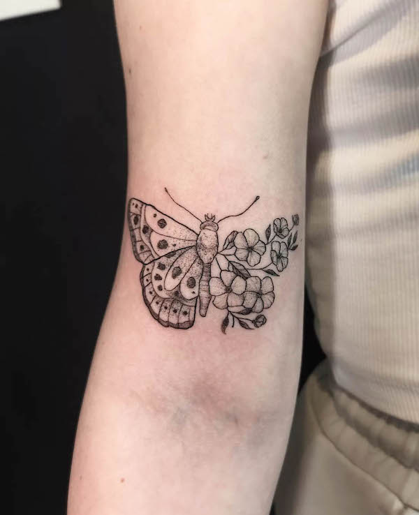 Half moth half flower tattoo by @kawka_ink