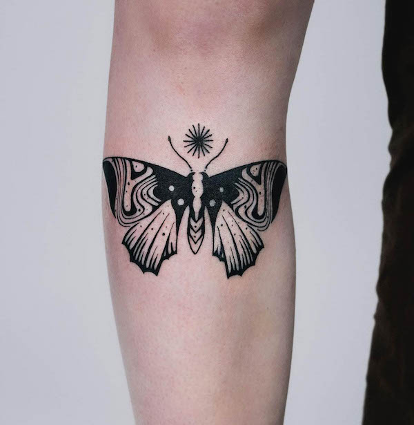 Swirl pattern moth tattoo by @myrkur_tattoo