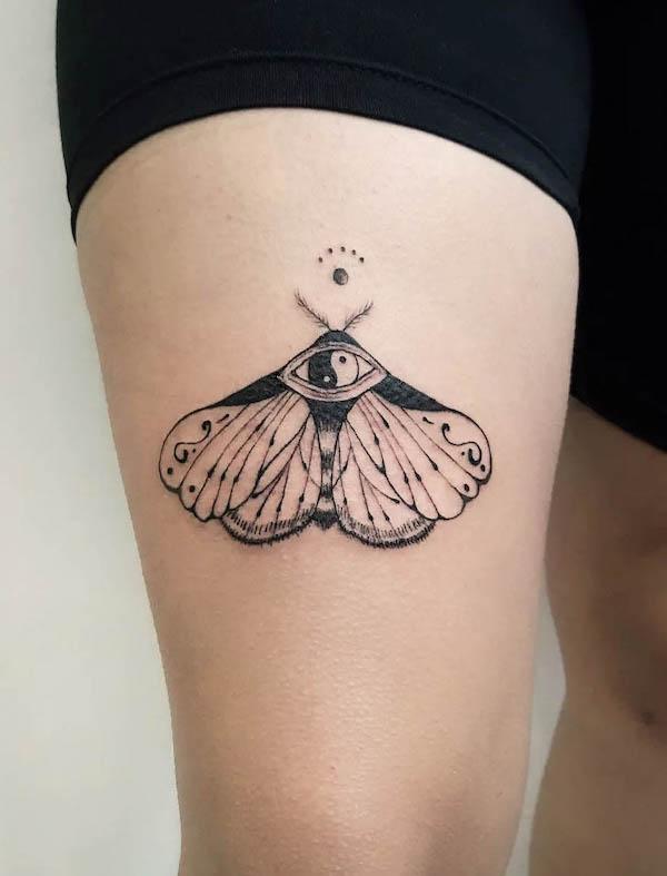 Yin and yang moth tattoo by @martina.tatts