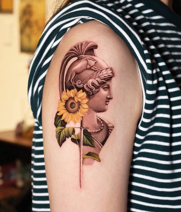 Athena with sunflower tattoo by @shu_tattooart