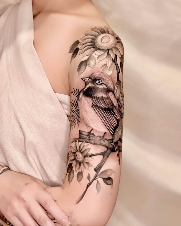 Black and grey sparrow and sunflower sleeve tattoo by @dudutattooist