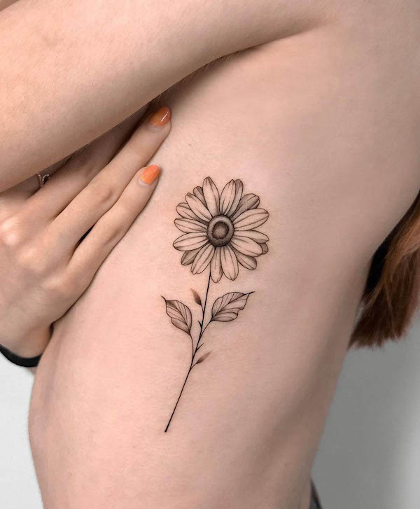 Black and white sunflower rib tattoo by @bihwa_tt