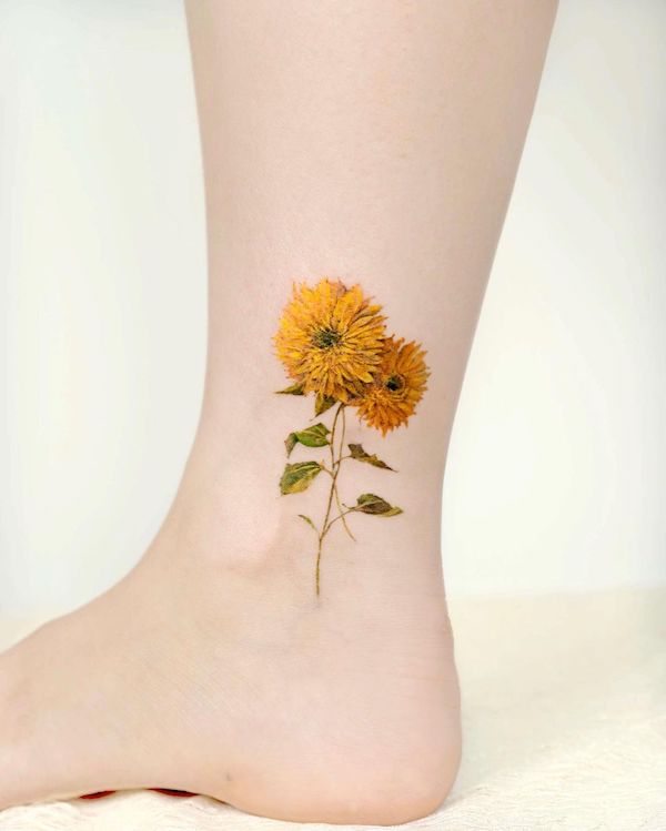 Intricate sunflower ankle tattoo by @tilda_tattoo