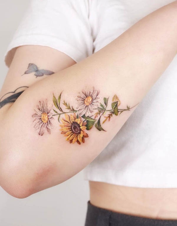 Realism sunflowers and daisies by @sozil_tattoo