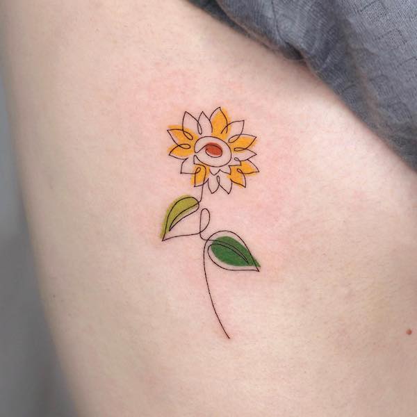 Simple colored sunflower tattoo by @som__tattoo