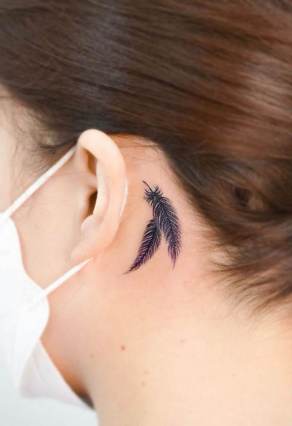 Small feather behind the ear tattoo by @o.ri_tattoo