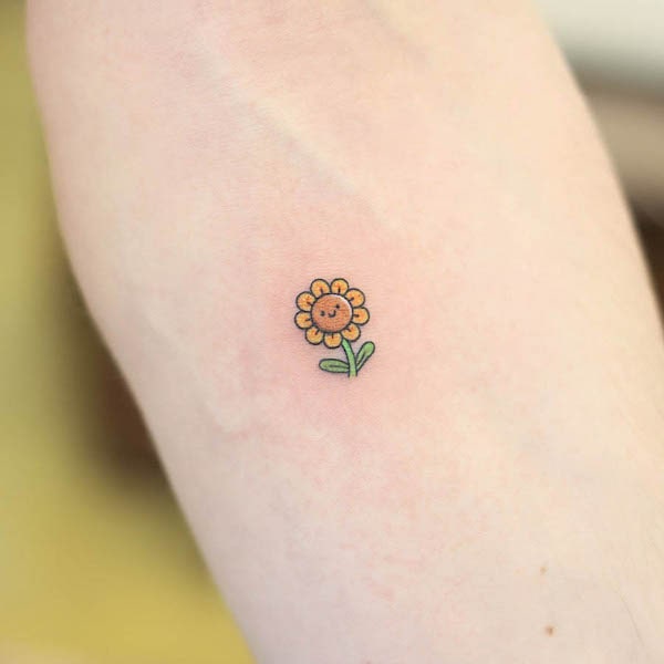Tiny cute sunflower tattoo by @wittybutton_tattoo