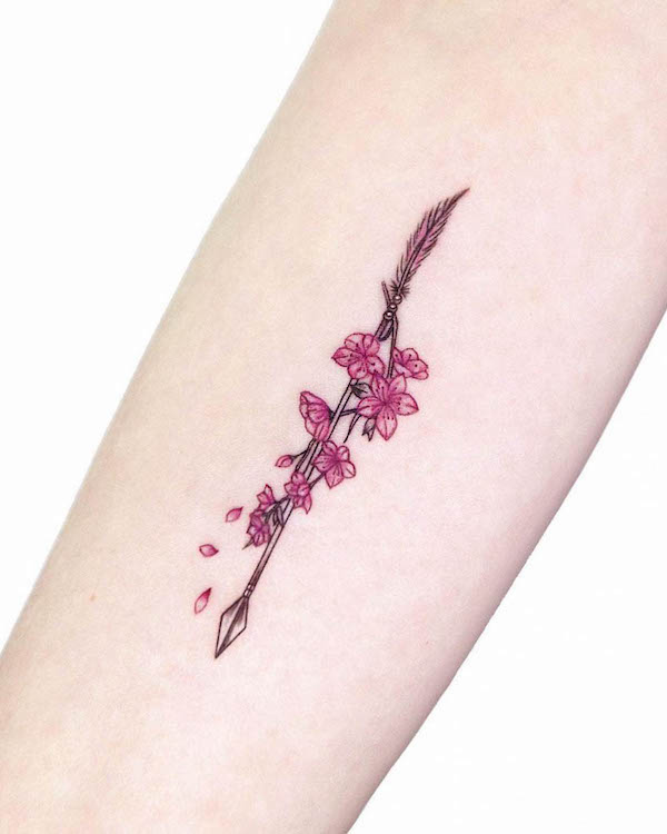 Arrow and cherry blossom tattoo by @ire_tattoo